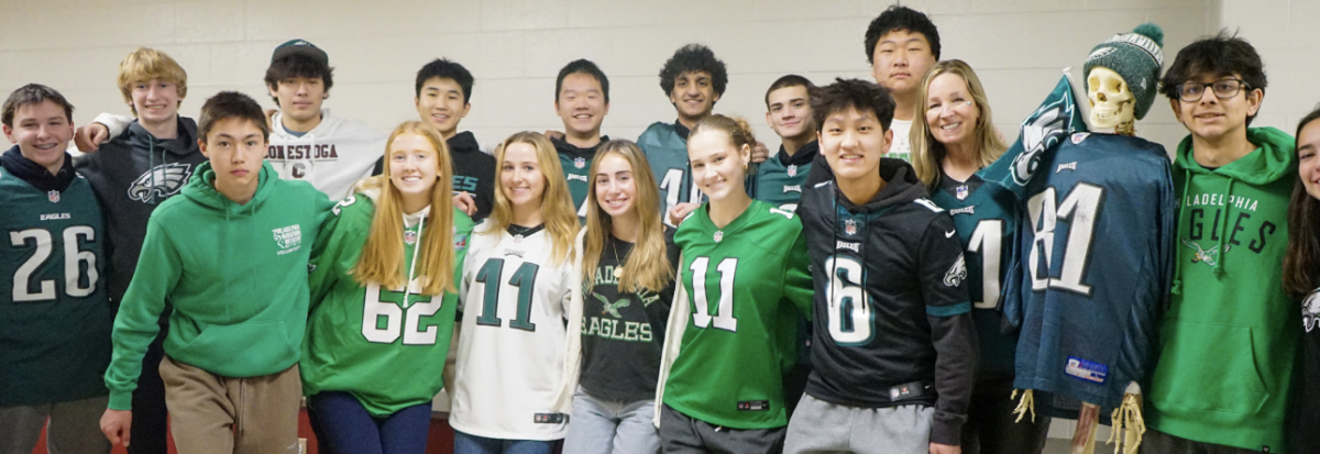 Pregame hype: Student Council members pose for a picture wearing Eagles-themed outfits. Throughout the season, Student Council held various Eagles-themed Spirit Days. 